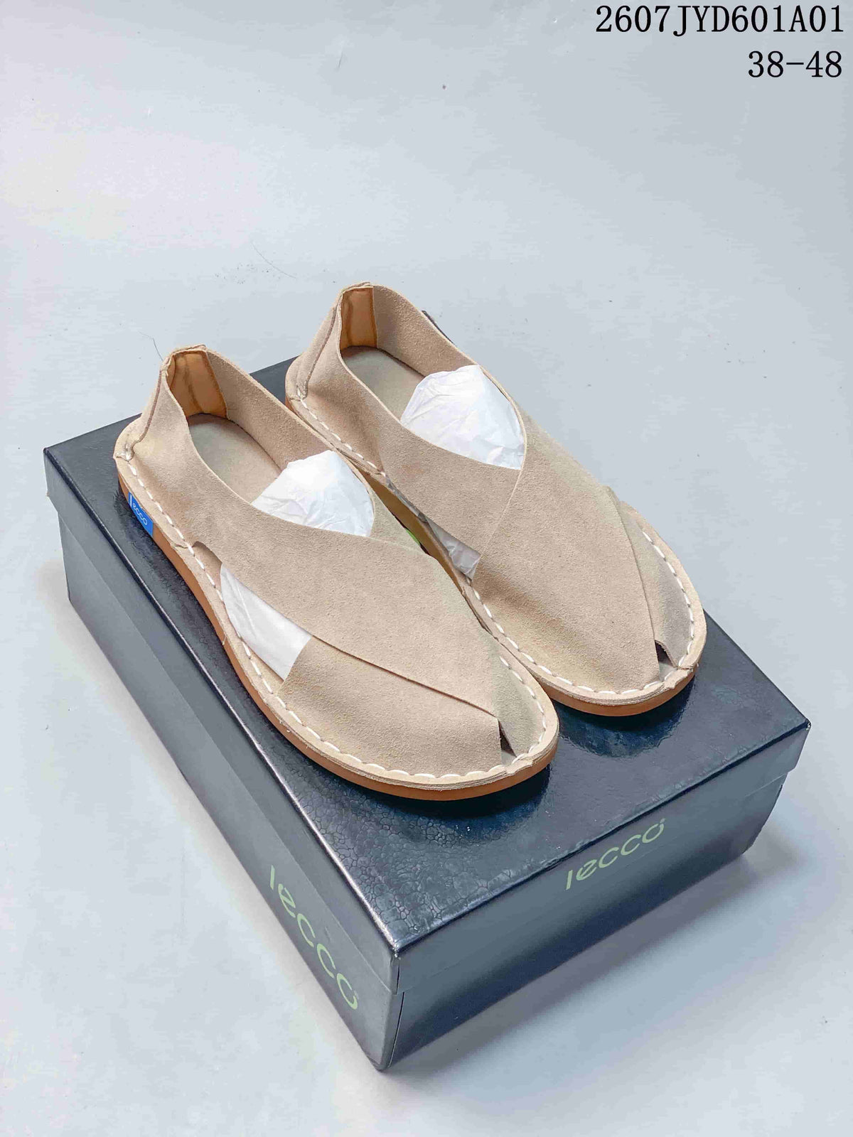 Pair of light beige cross-strap casual shoes on a branded box; image label shows style code 2607JYD601A01 and sizes 38–48.