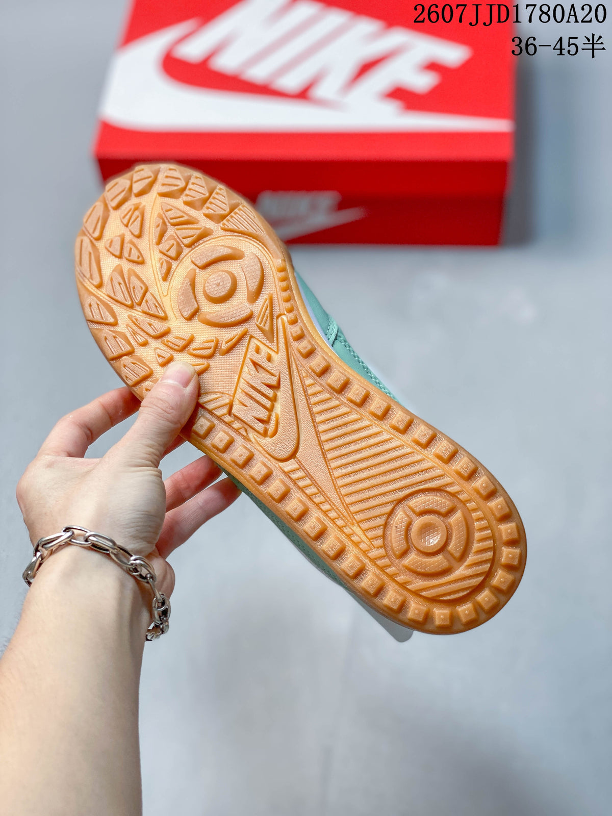 Close view of the gum-colored outsole with raised geometric tread details.