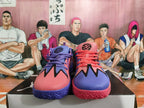 Front view of pink and purple basketball sneakers with black graphic accents