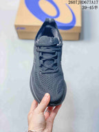 Top view of a black ASICS running shoe showing the lace-up closure, padded tongue and perforated-looking forefoot panel.