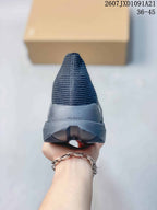 Rear view showing the ribbed upper, heel structure, and split-style outsole design.