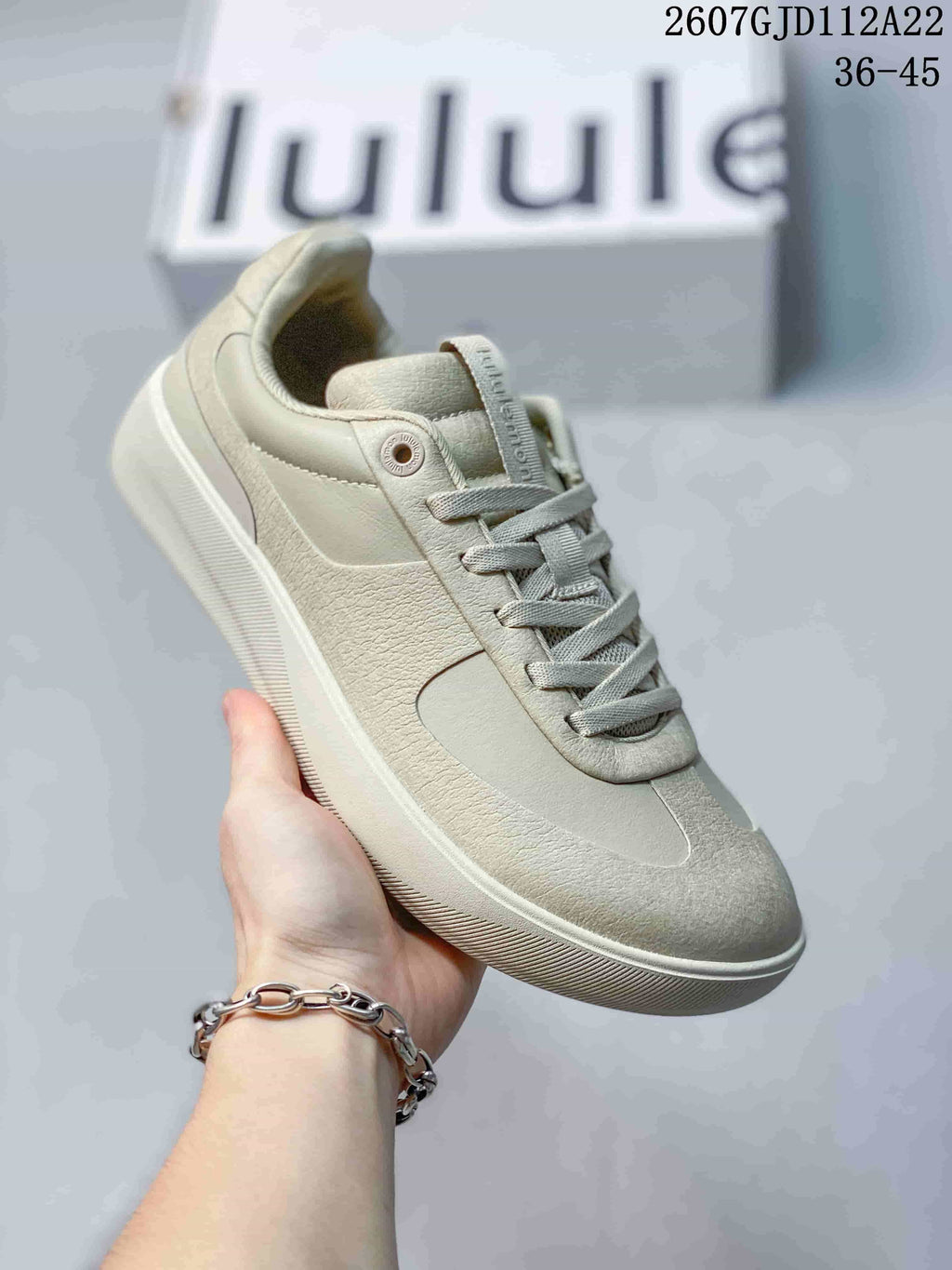 Angled side view of a light neutral lululemon Cityverse sneaker showing the lace-up upper, padded collar and textured outsole.