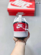 Rear view showing the red heel panel, white Nike branding and padded collar.