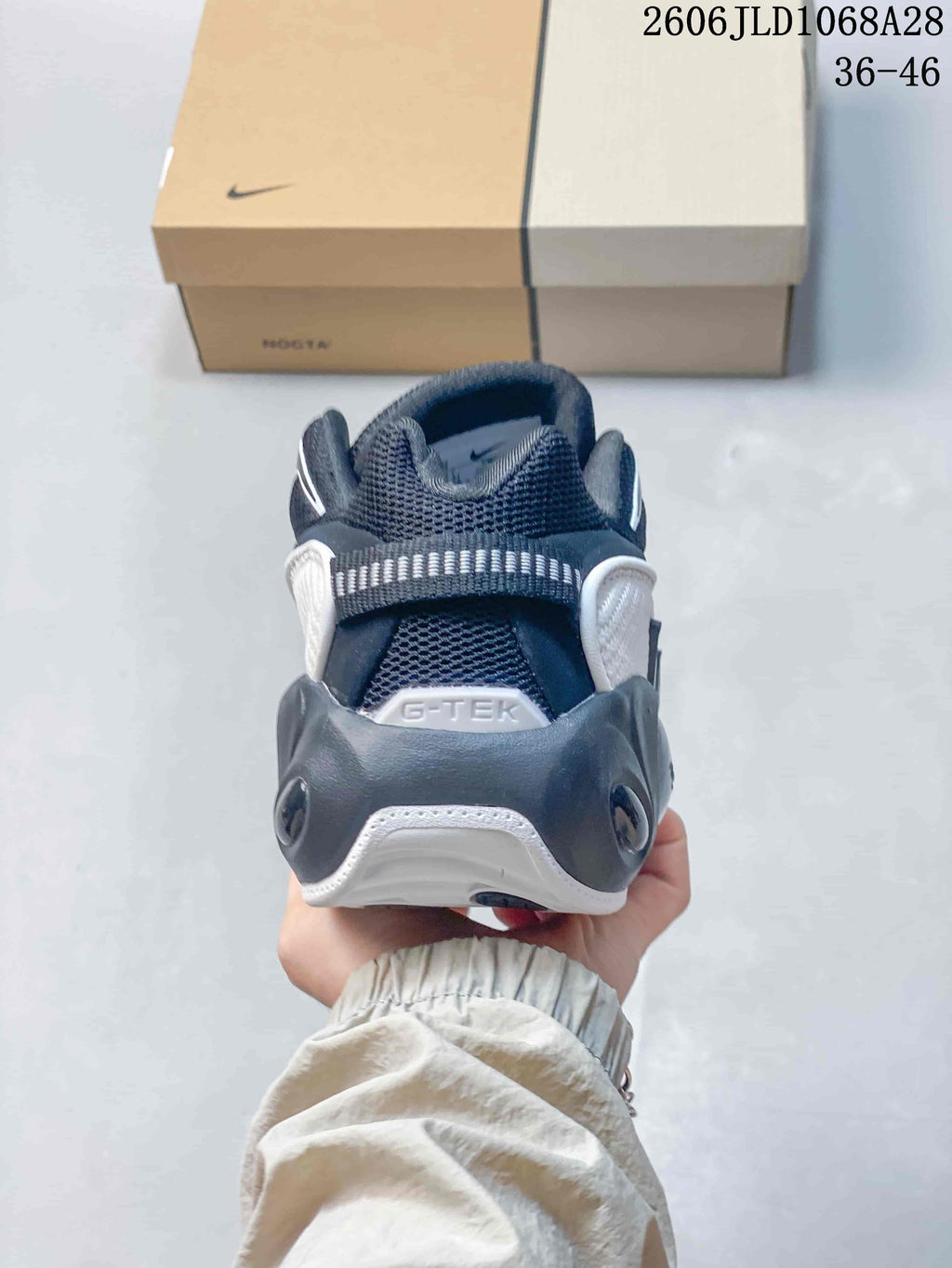 Rear view of a Nike NOCTA Glide sneaker showing the heel details.