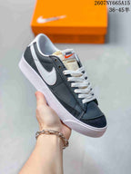 Angled side view showing the black and white upper, white Swoosh, and textured outsole.