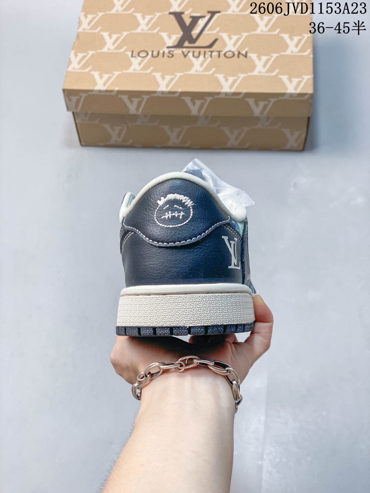Rear view showing the navy heel panel and light-colored midsole.