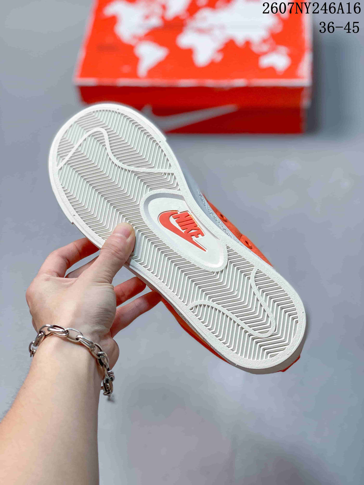 Underside view of the sneaker showing the white outsole with herringbone tread and a Nike logo insert.