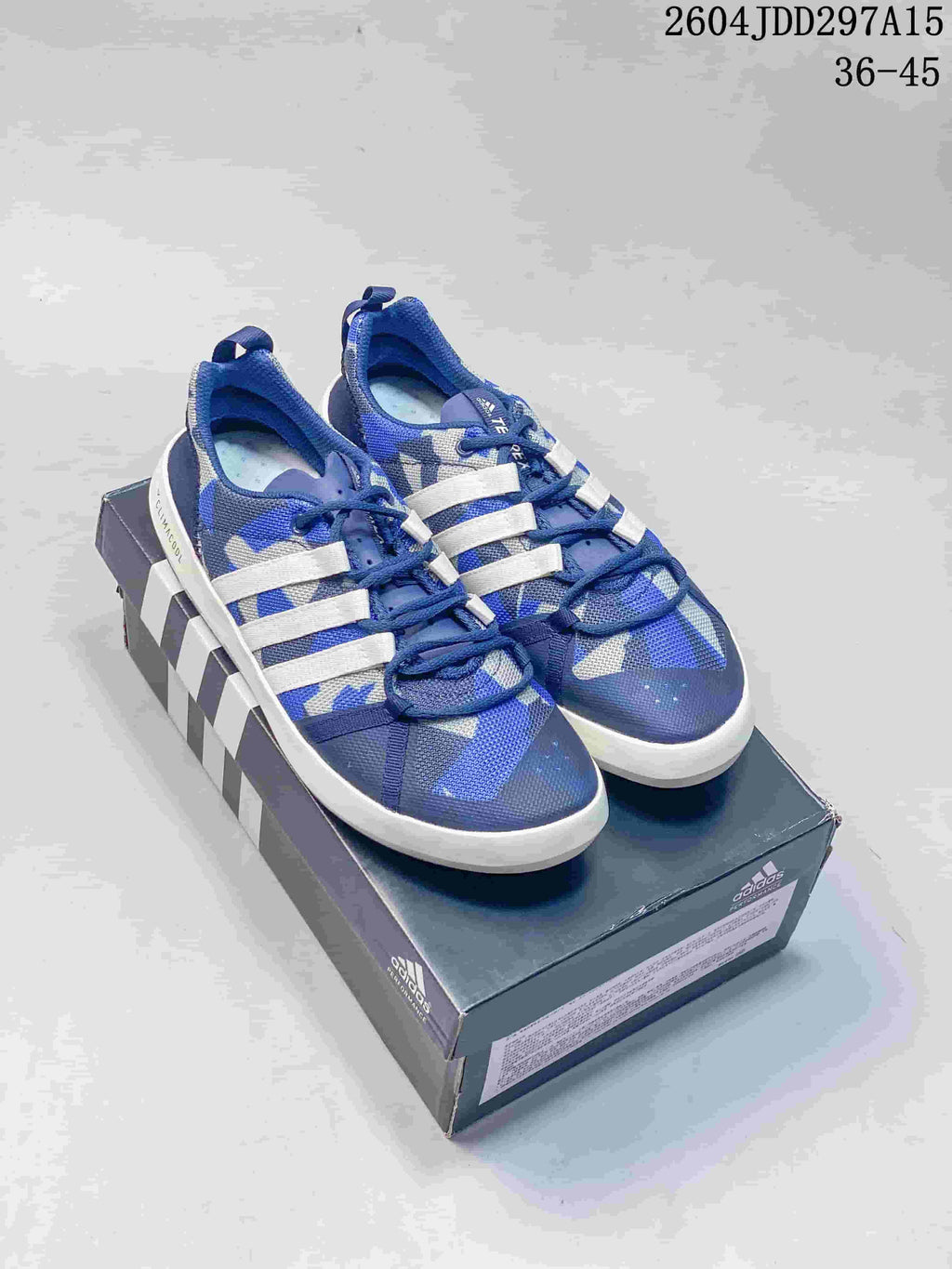 Blue and white adidas Terrex CC Boat shoes displayed on an adidas shoebox; image text shows style code 2604JDD297A15 and size range 36-45.