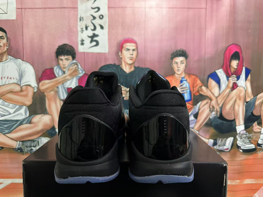 Rear view of black Nike basketball shoes with translucent blue outsoles