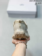 Rear view of the sneaker showing the padded heel collar, pull tab, and textured heel outsole.