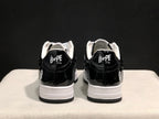 Rear view showing black glossy heel panels, white midsoles and Bape Sta branding on the heel tabs.