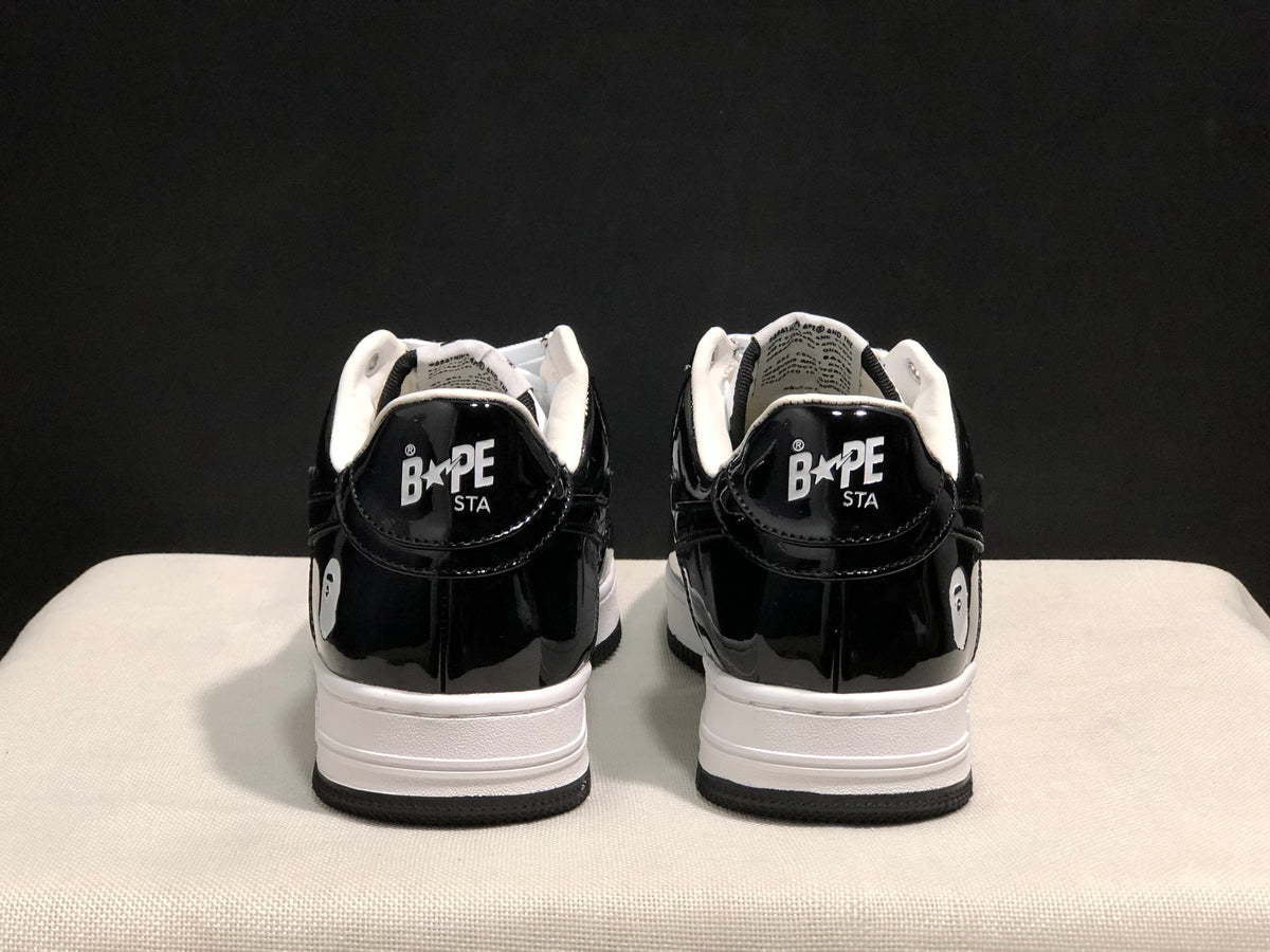 Rear view showing black glossy heel panels, white midsoles and Bape Sta branding on the heel tabs.
