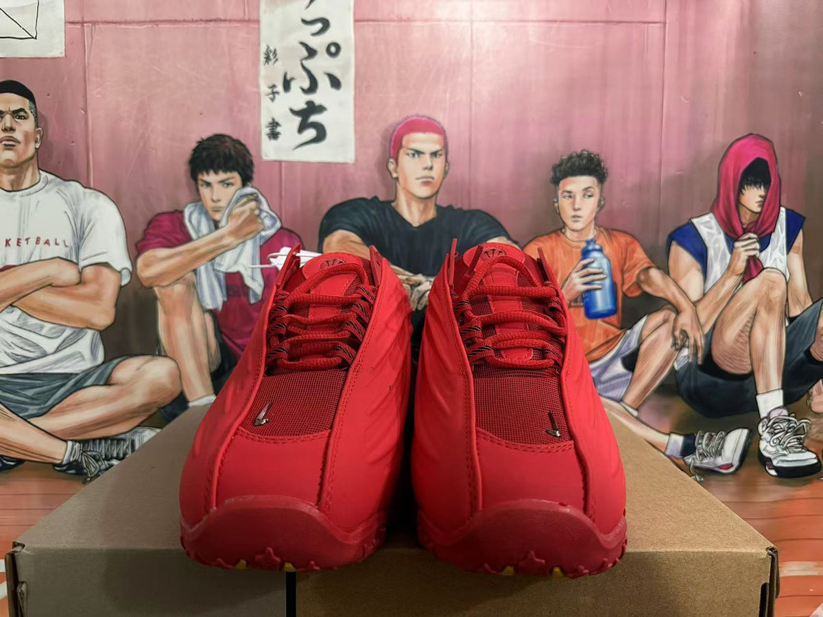 Front view showing red laces and textured panels on Nike basketball shoes