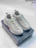 Pair of grey BOSS sneakers with lime accents on a branded shoe box
