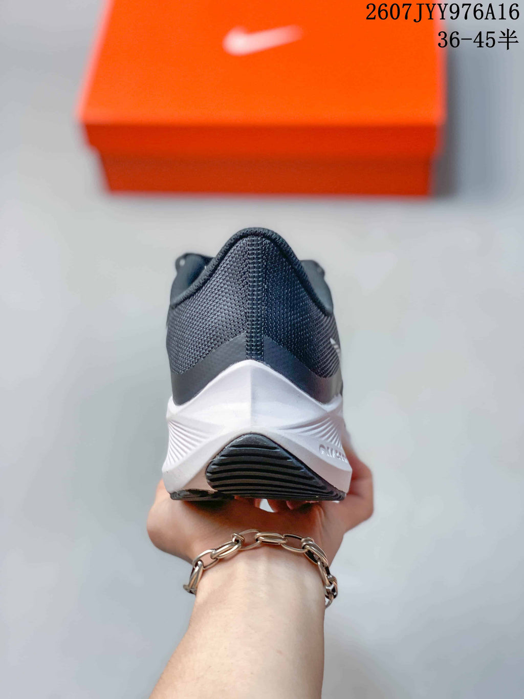 Rear view showing the dark heel, white midsole, and black outsole of the sneaker.