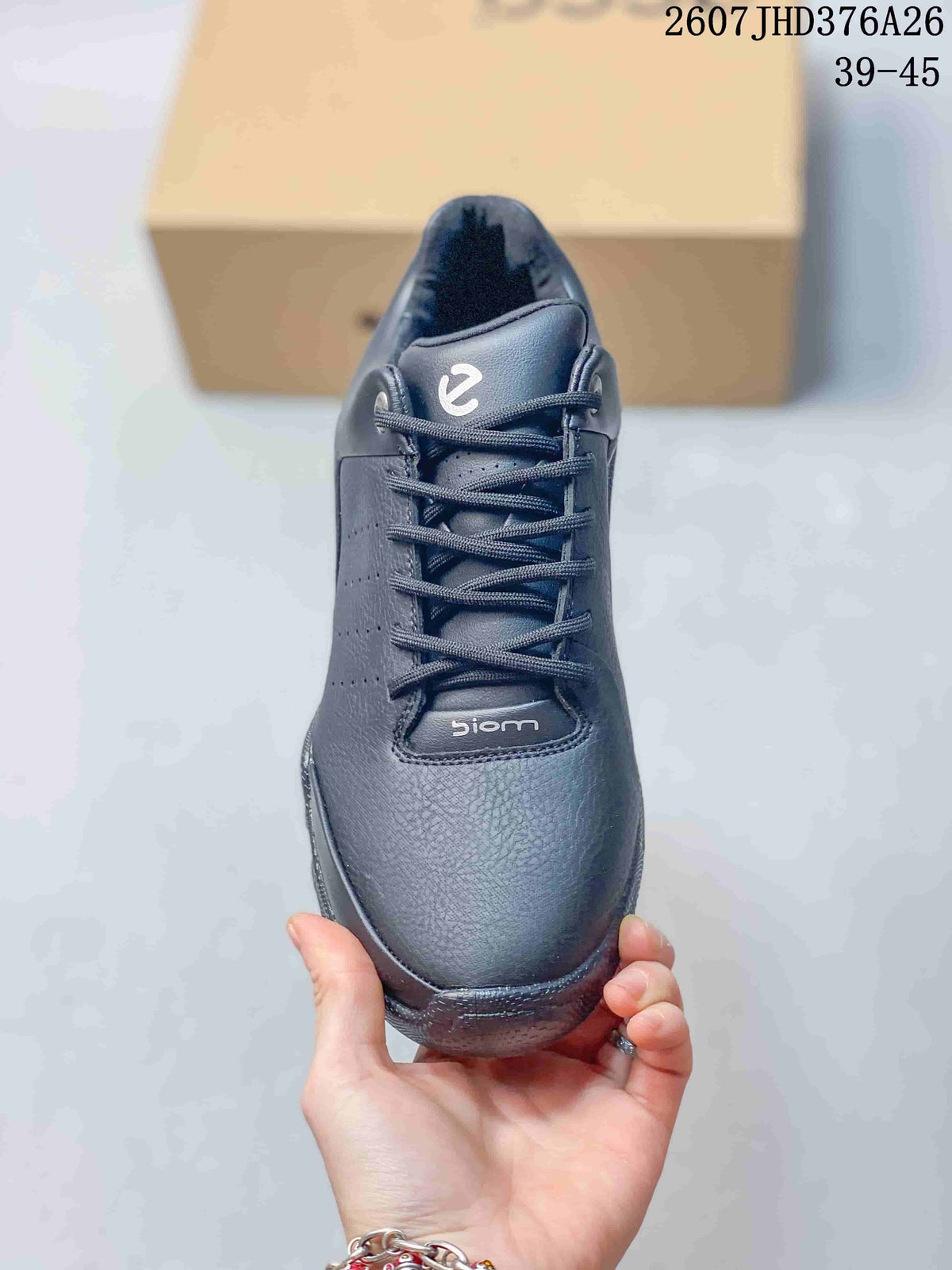 Top view of the black sneaker showing the laces, perforated side panel, padded tongue, and BIOM branding.