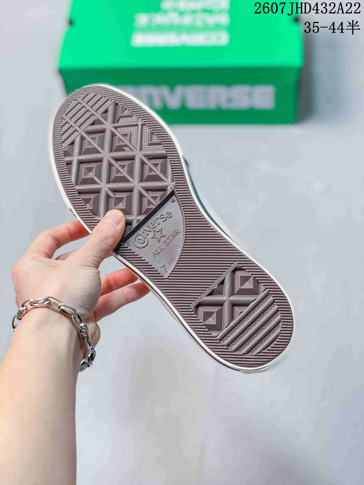 Close view of the patterned rubber outsole with Converse All Star branding.