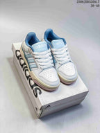 White and light blue adidas Entrap sneakers displayed on an adidas shoe box; image text shows style code 2506JDD320A17 and size range 36–40.