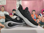 Pair of black and gray basketball shoes shown at an angle.