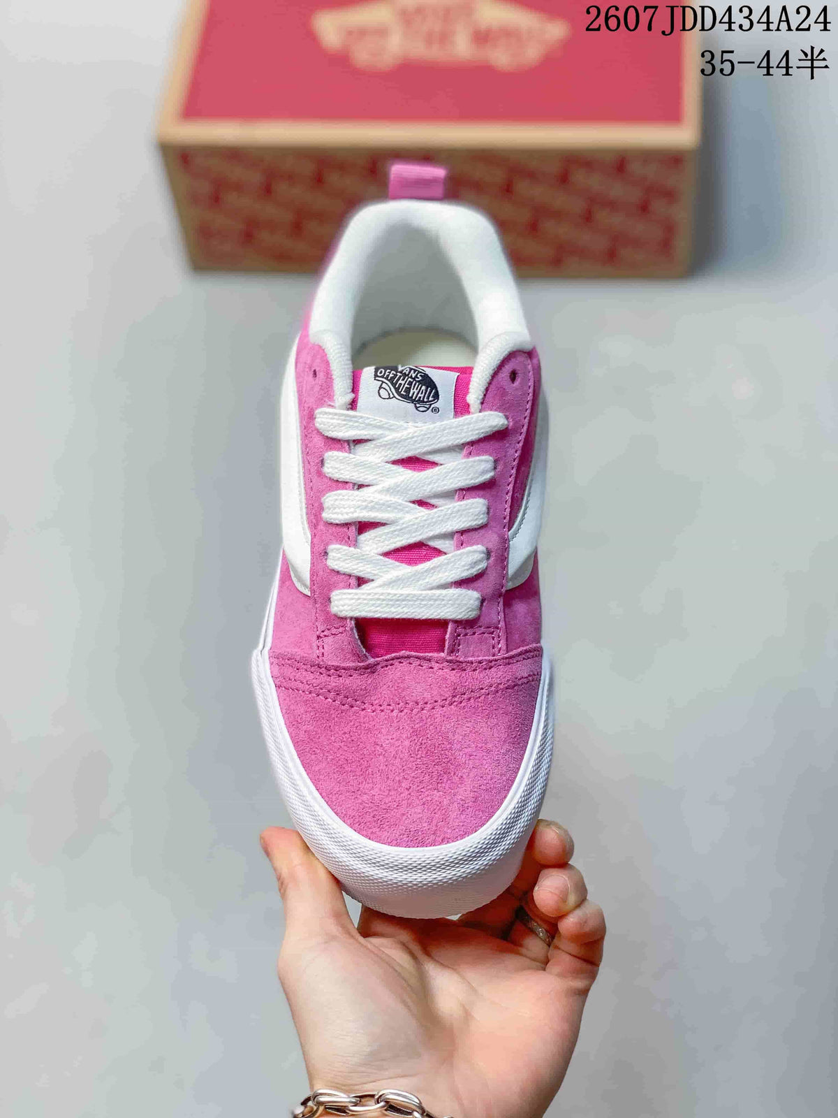 Top view of the pink sneaker showing the lace-up front, padded collar and white toe bumper.