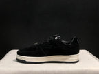 Lateral side view highlighting the tonal star side panel, padded collar and layered sole.