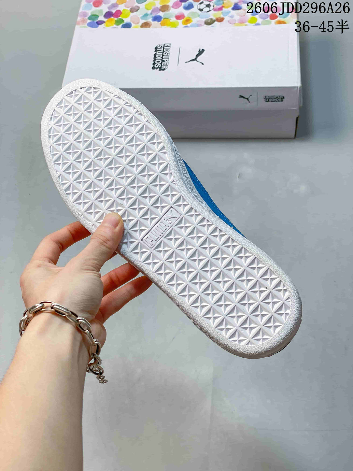 Close view of the white rubber outsole showing a repeating geometric tread pattern and PUMA branding.