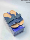 Pair of navy Birkenstock sandals displayed on a branded shoebox, with style code 2607JXD295A15 and size range 35–45 shown above.