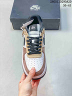 Top view of the sneaker showing black laces, a beige lace panel, a white perforated toe box, and contrasting pink edging.