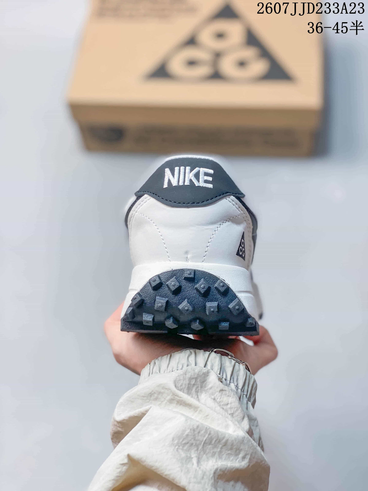 Rear view showing the Nike heel branding, padded collar, and textured outsole edge.