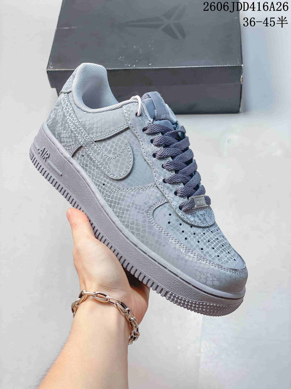 Close view of a gray patterned low-top sneaker