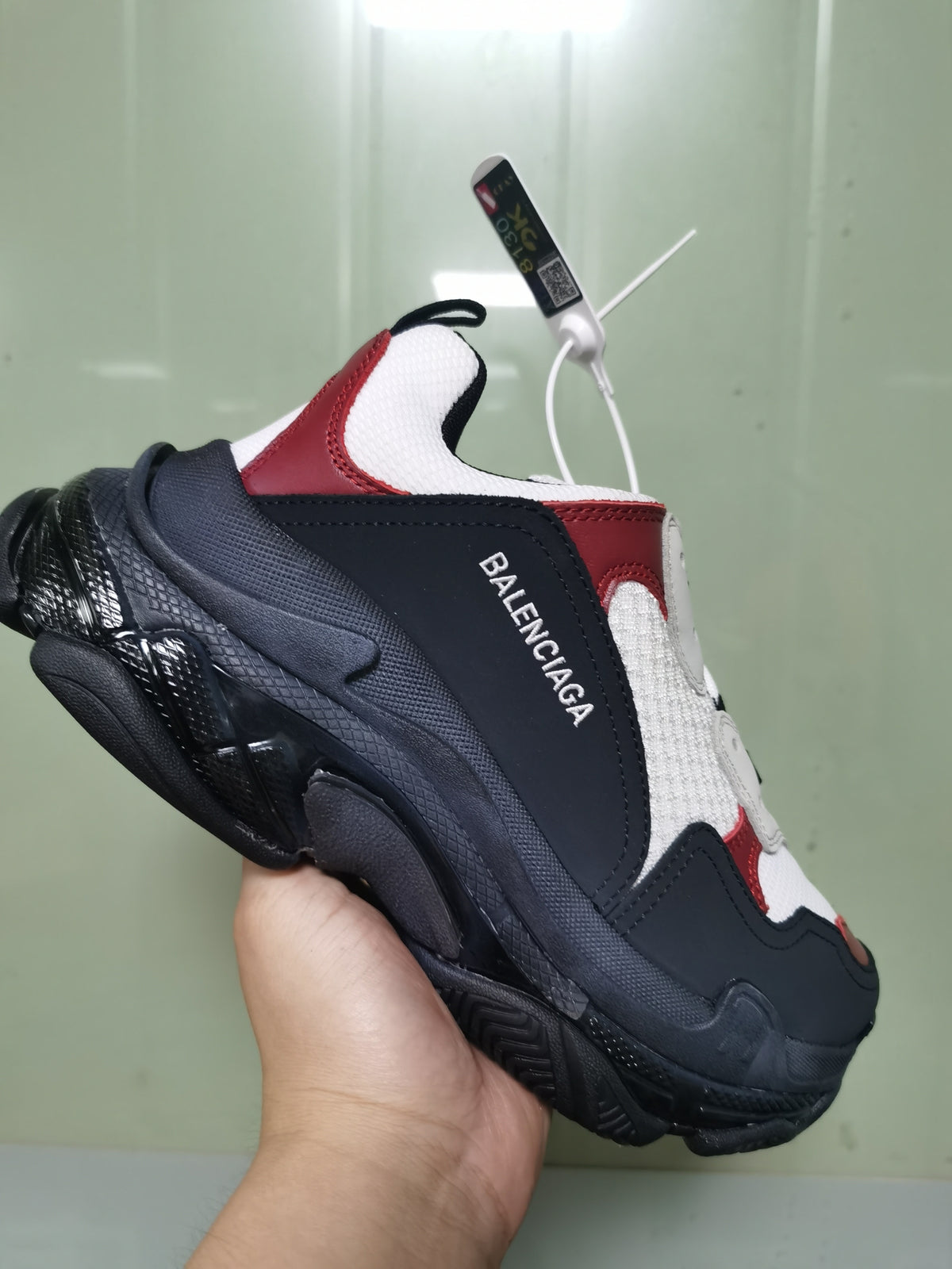 Close angled view showing the Balenciaga side branding, layered upper panels and chunky outsole.