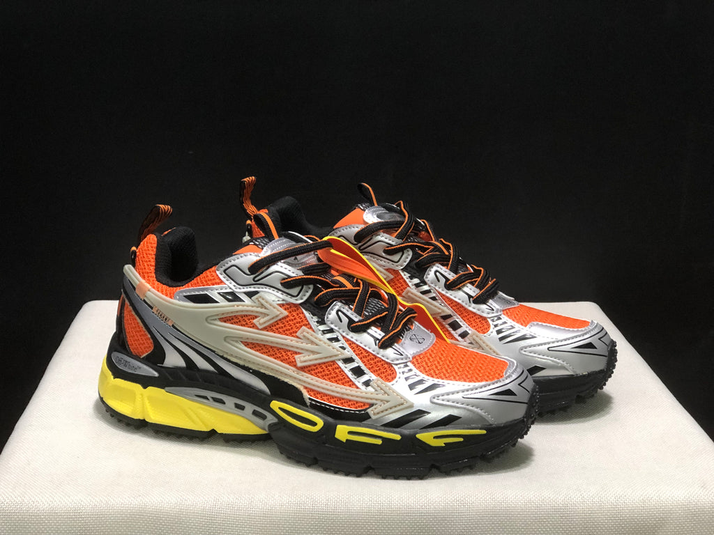 Three-quarter view of the pair highlighting the layered upper, lace-up construction, and contrasting outsole.