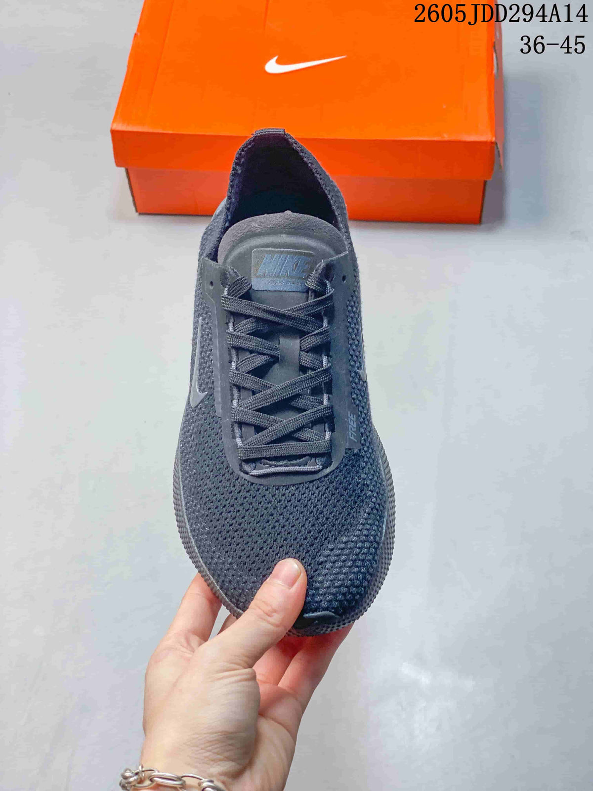 Top view of the dark gray Nike Free sneaker showing the laces, tongue, knit-style upper, and Swoosh detail.