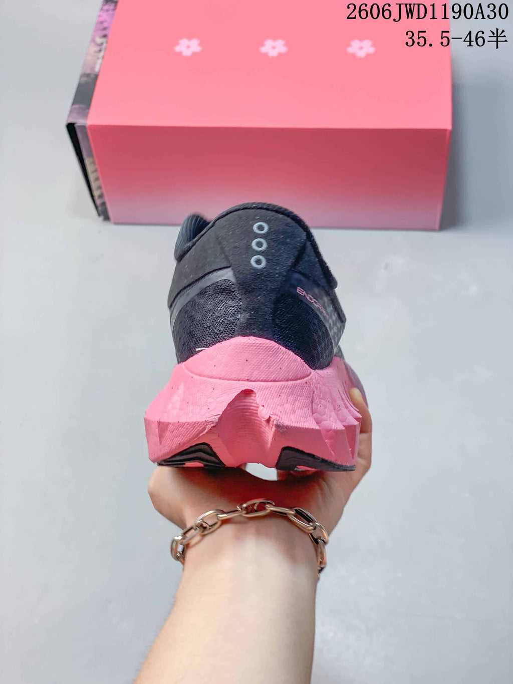 Rear view showing the sculpted pink heel and dark upper