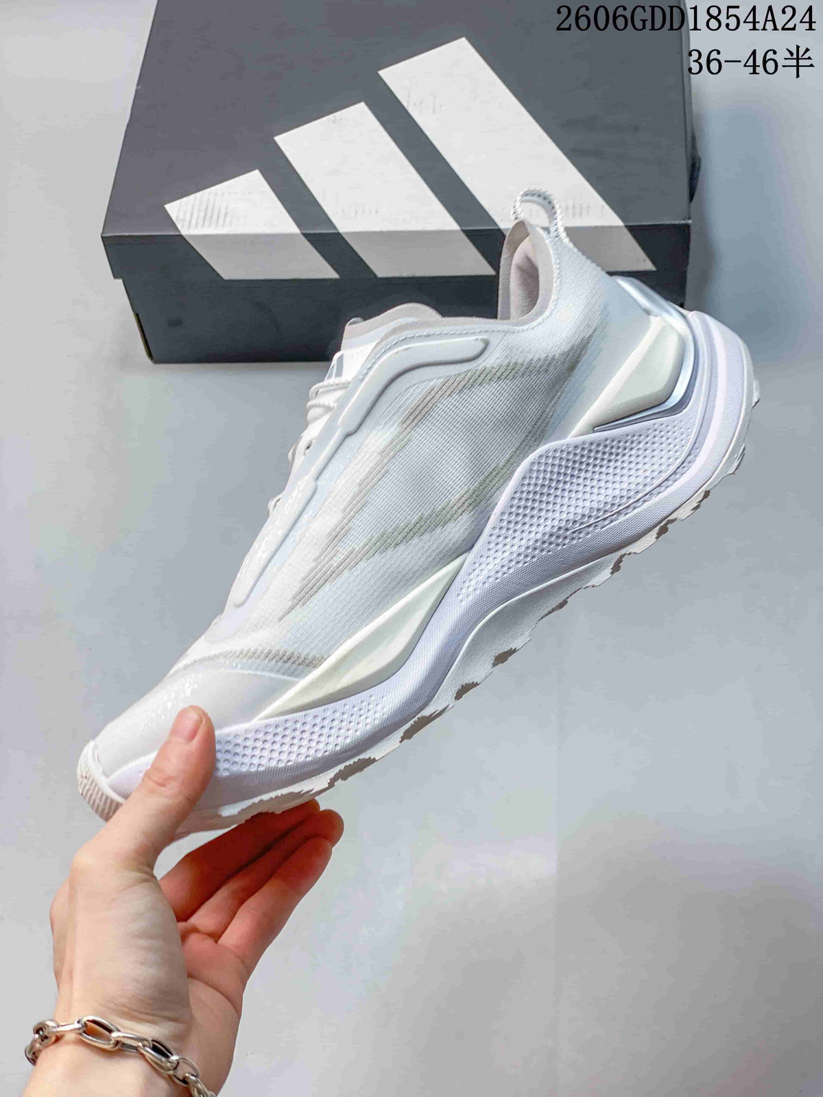 Side view of a white and light-gray low-top trail-running shoe