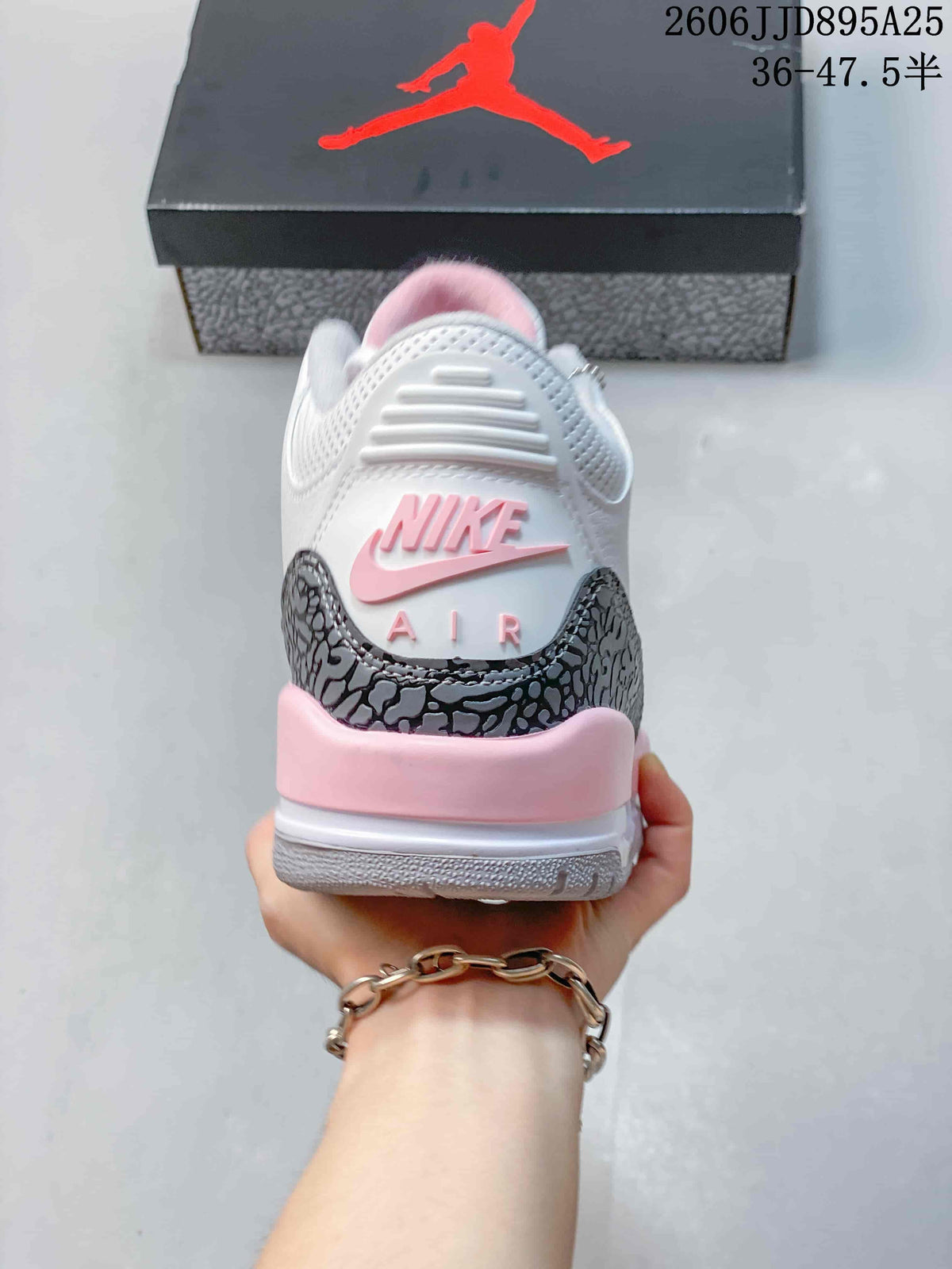 Rear view showing the raised heel branding, gray elephant-print overlay, pink heel accent, and padded collar.