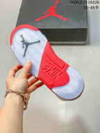 Close-up of the sneaker outsole with translucent sections and a red center panel