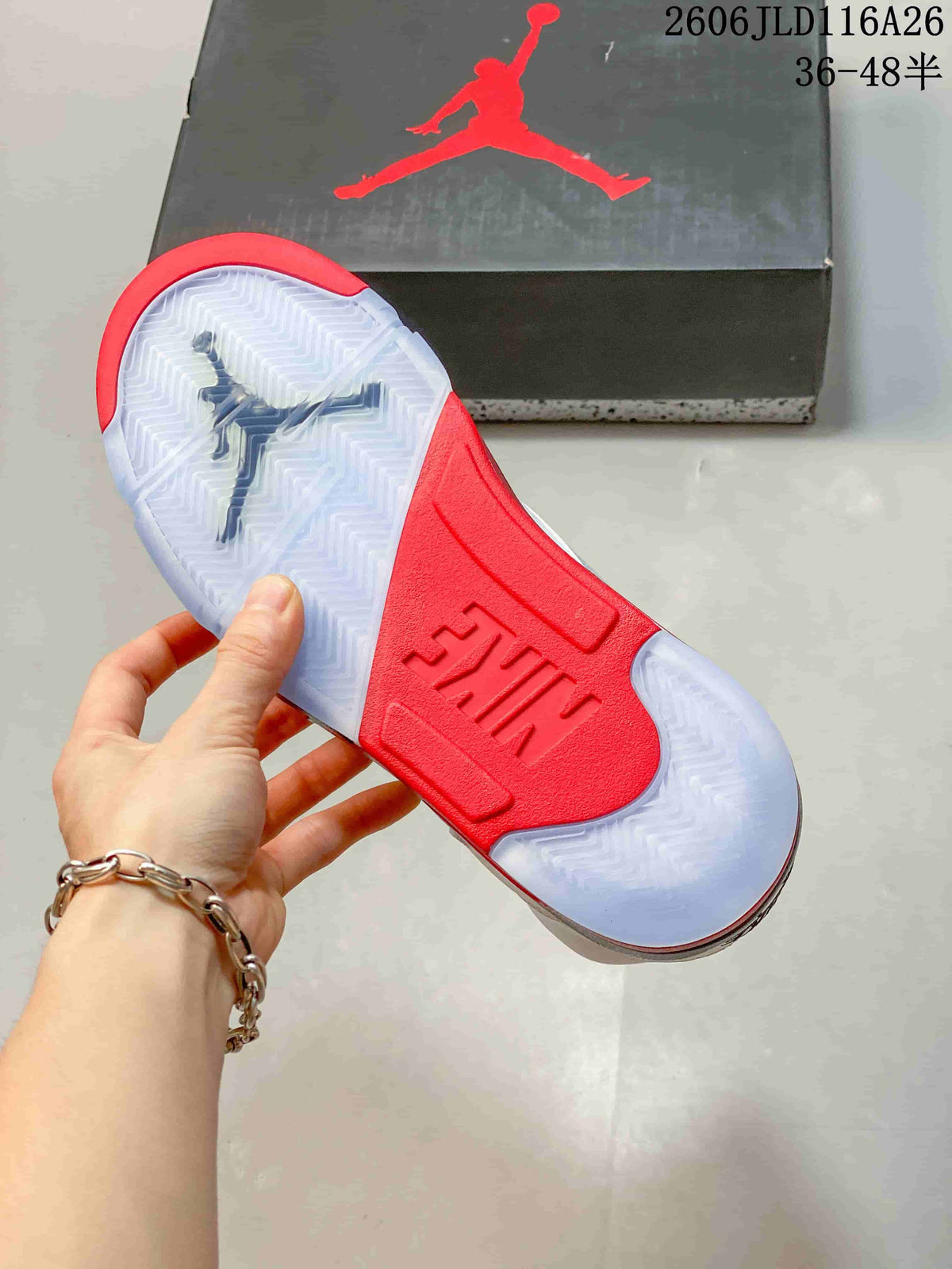 Close-up of the sneaker outsole with translucent sections and a red center panel