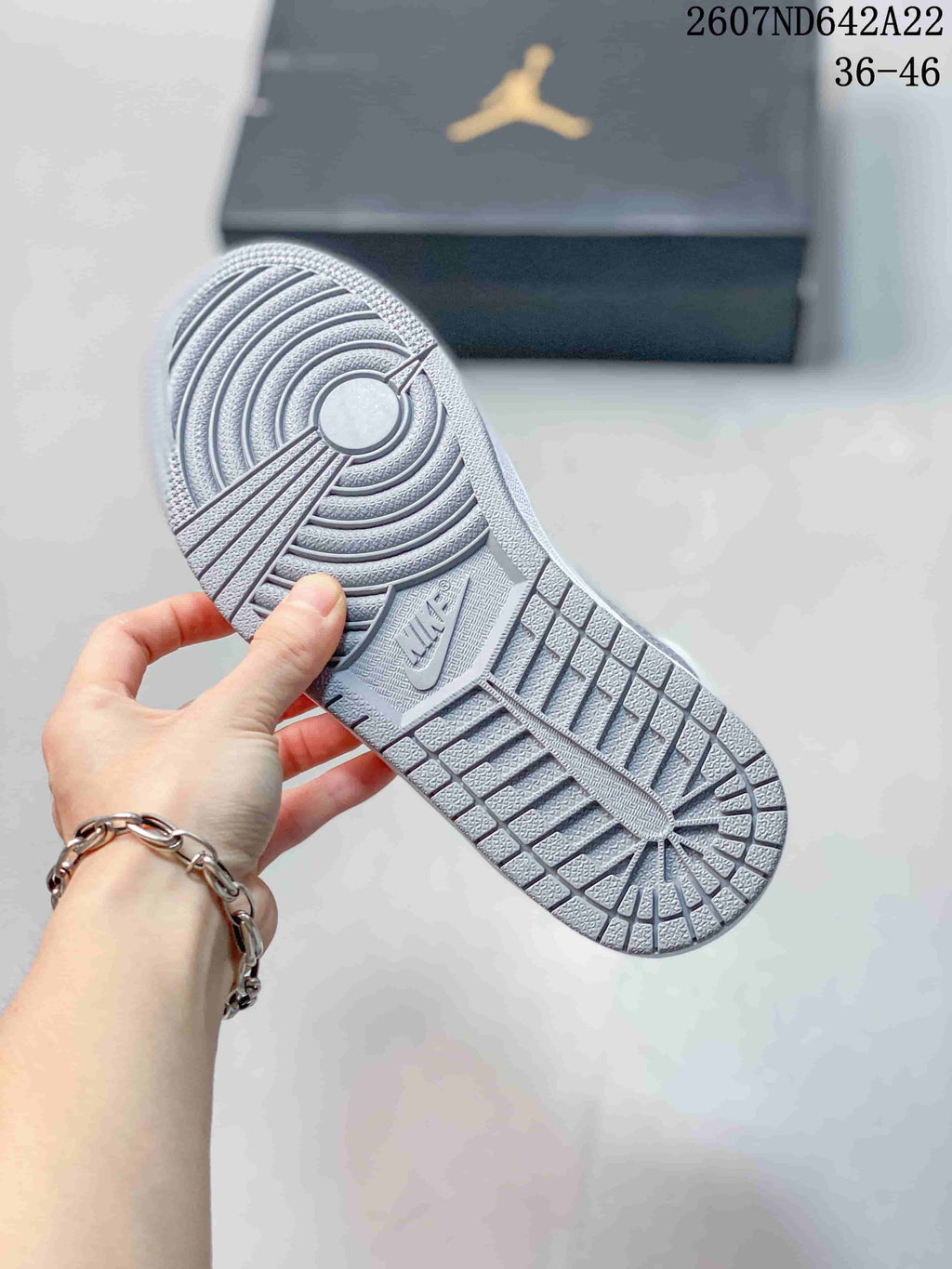 Close view of the textured outsole with circular and geometric traction patterns; image text shows sizes 36–46.