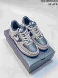 Pair of grey and white Nike Air Force 1 '07 low-top sneakers displayed on a shoebox.