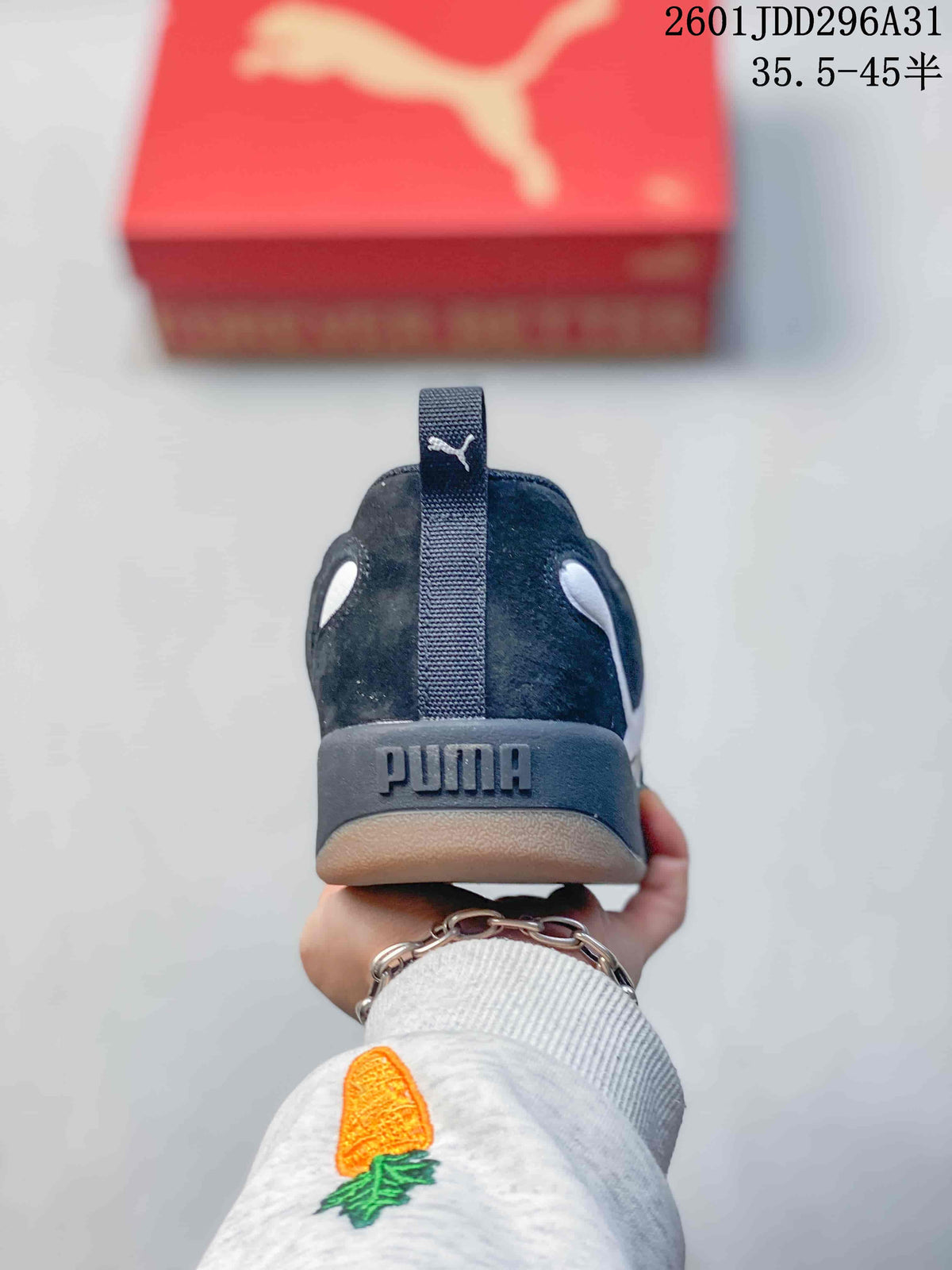 Rear view of a black PUMA sneaker showing the heel branding and pull tab.