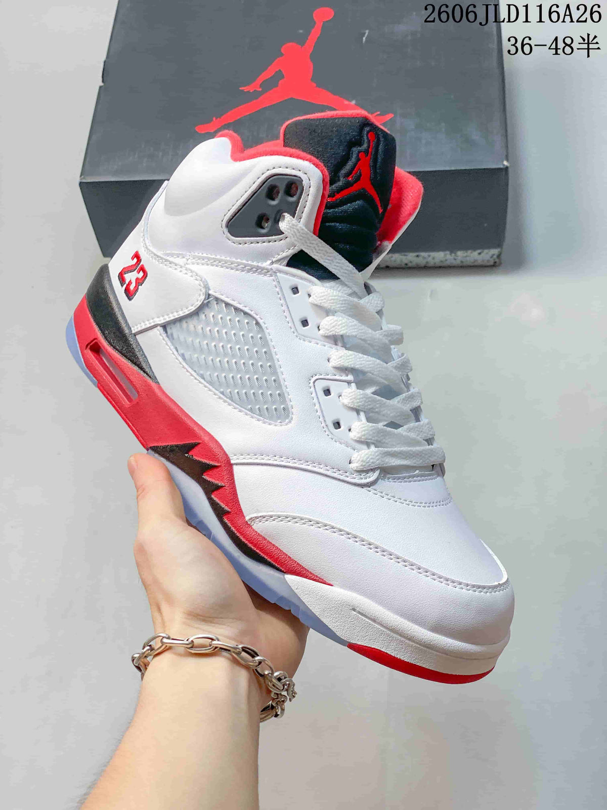 Angled side view of the white Jordan Air Jordan 5 Retro sneaker with red and black accents