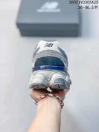 Rear view showing the padded heel area, layered sole, and New Balance branding.