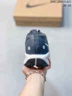 Rear view of the sneaker showing the dark padded heel, white midsole, and black outsole lugs.