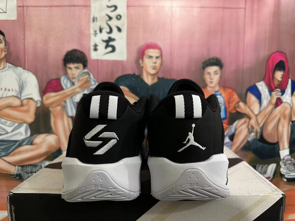 Rear view of black basketball shoes with white heel details
