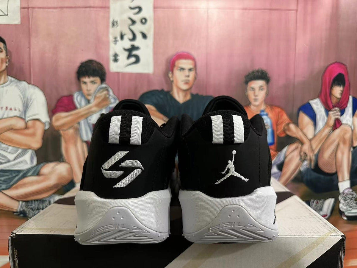 Rear view of black basketball shoes with white heel details