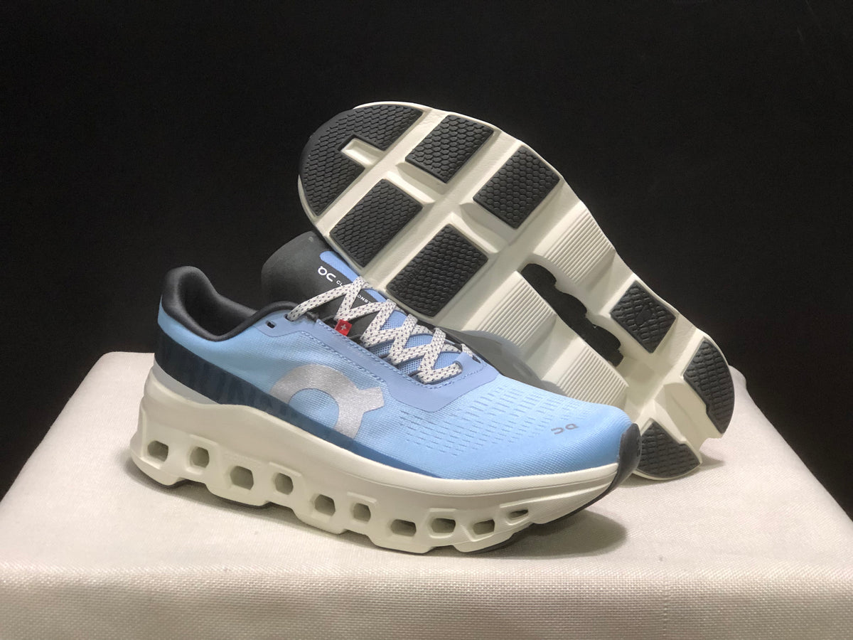 Angled view showing the outsole tread, white sole structure, and light blue upper.