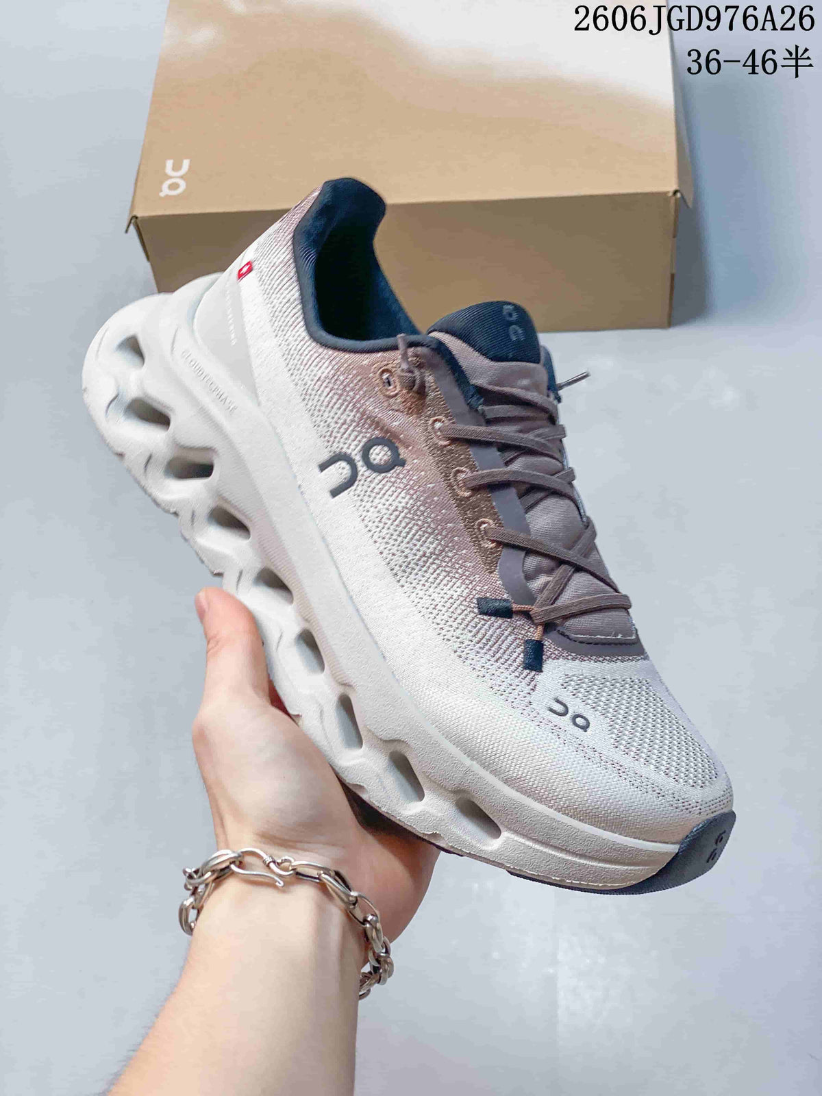 Angled view of the sneaker showing its white and mauve upper and sculpted sole.