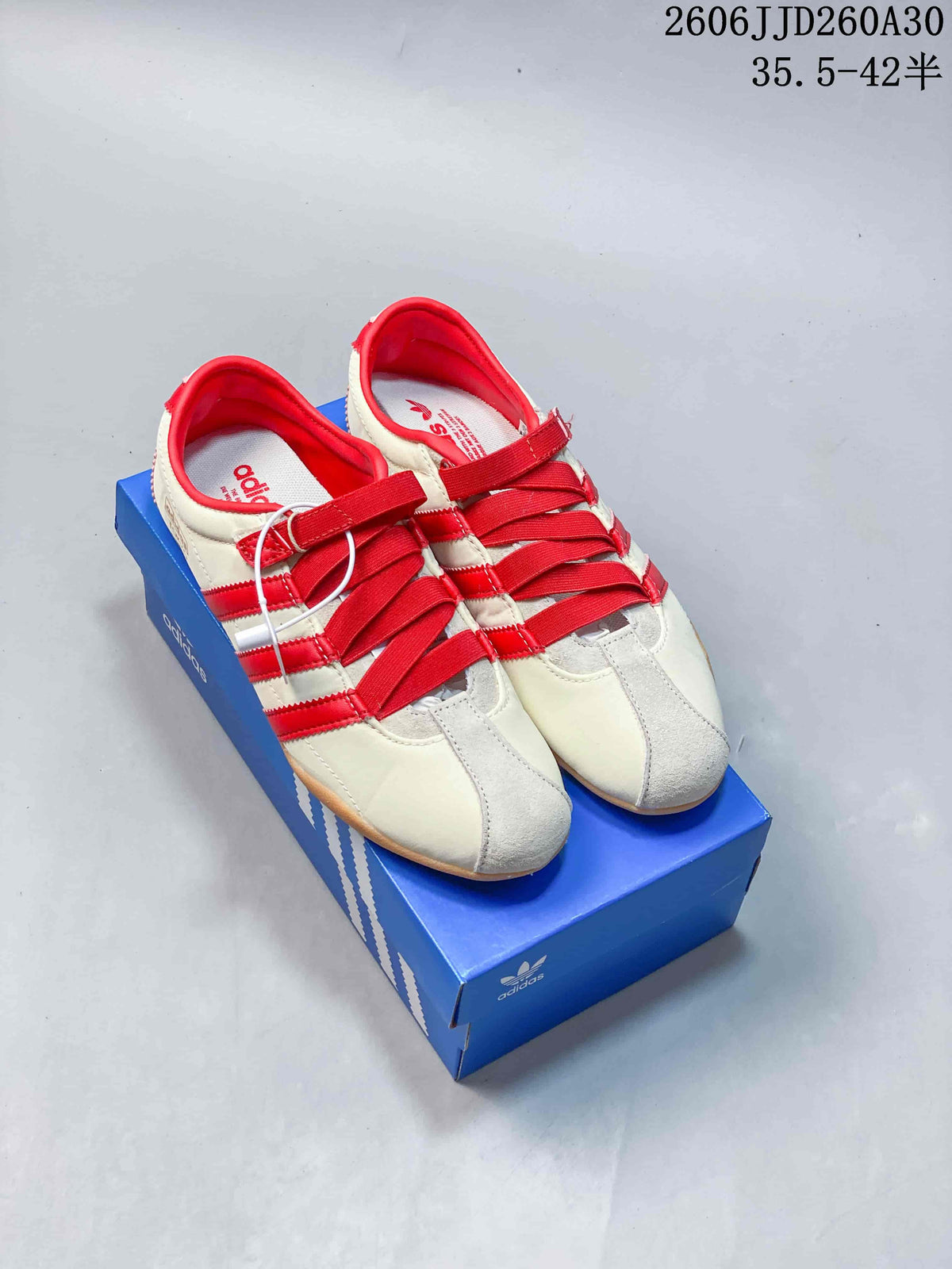 Cream and red adidas Originals Tokyo MJ low-top sneakers with strap-and-lace closure and gum-colored soles.
