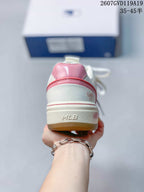 Rear view of the white and pink sneaker showing the pink heel panel, layered heel trim, bow detail and raised MLB branding on the midsole.